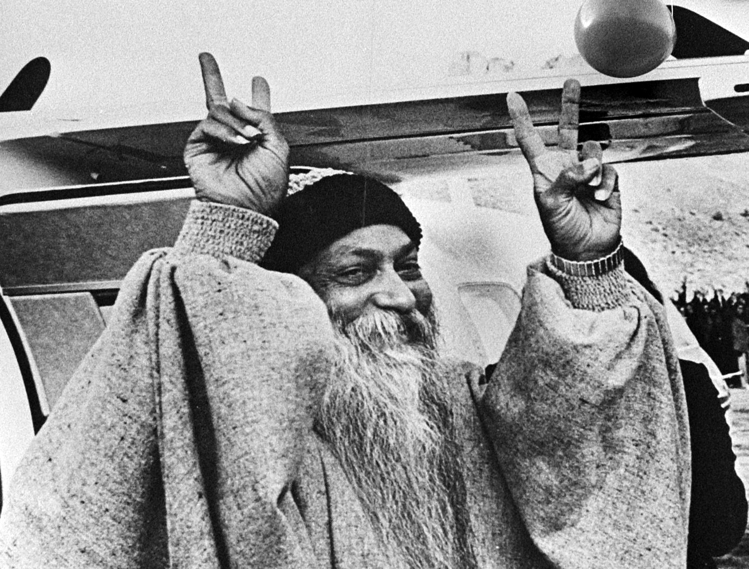 Black and white archival portrait of Osho